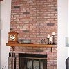 Floor to ceiling Brick Fireplace and hearth - custom wood mantel