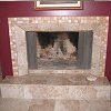 Marble Face Fireplace and raised hearth - mosaic tile surround