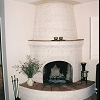 Kiva Style Plaster Fireplace with spanish tile raised hearth