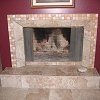 Travertine Tile Face Fireplace and raised hearth - decorative tile surround