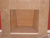 Rumford style fireplace with tiled face and hearth