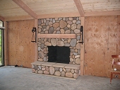 Eldorado river stone veneer fireplace, raised hearth with cap stone