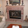 Brick Fireplace and hearth - custom wood mantel