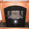 Black Marble Face Fireplace and hearth - custom floor to ceiling wood mantel and surround