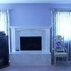 Marble Face Fireplace and raised hearth - custom wood mantel and surround