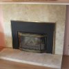 Travertine and Black Marble Tiled Fireplace - decorative gas log set