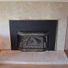 Travertine and Black Marble Tiled Fireplace - decorative gas log set
