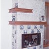 Custom Masonry Stone Tile Fireplace and raised hearth - inlaid Dutch theme decorative tiles - custom wood mantel and high shelf