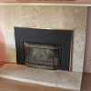 Travertine and Black Marble Tiled Fireplace - decorative gas log set