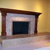 Mosaic Tile Face Fireplace with travertine tiled raised hearth - custom wood mantel and surround
