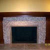 Mosaic Tile Face Fireplace with travertine tiled raised hearth - custom wood mantel and surround