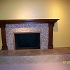 Mosaic Tile Face Fireplace with travertine tiled raised hearth - custom wood mantel and surround